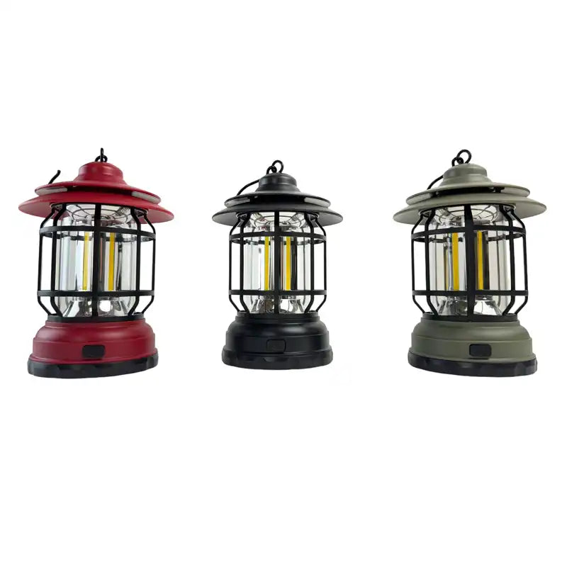 Three hanging lanterns in red, black, and green 