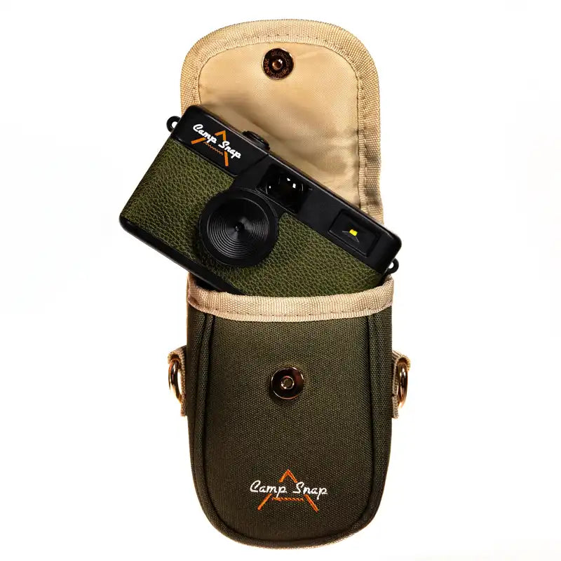 Green phone case with camera attachment and 'Camp Snap' branding on a white background