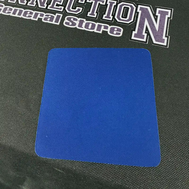Duffel Repair patch after being ironed to a black Camp Connection Duffel.