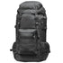A large black tactical backpack with multiple zippered compartments, side mesh pockets, and compression straps