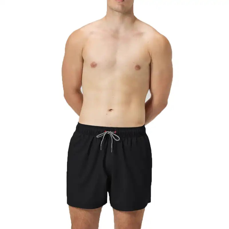 Man wearing black speedo bathing suit.