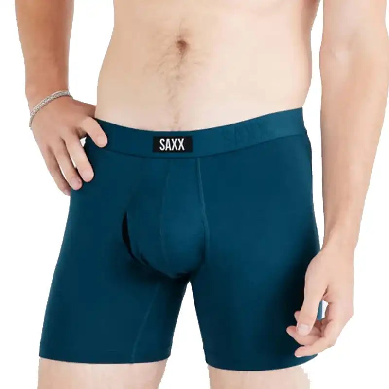 Teal boxer briefs with 'SAXX' branding on a white background