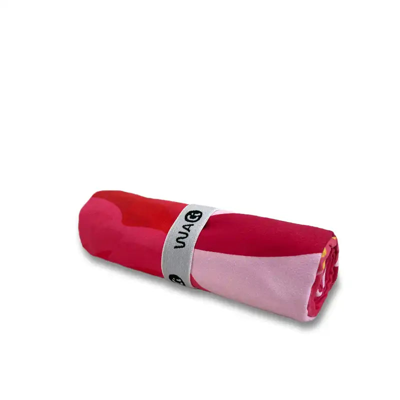 Rolled-up pink microfiber towel 