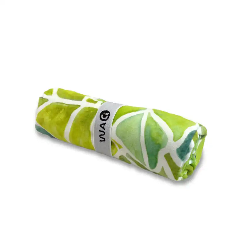Rolled green and white patterned microfiber towel 