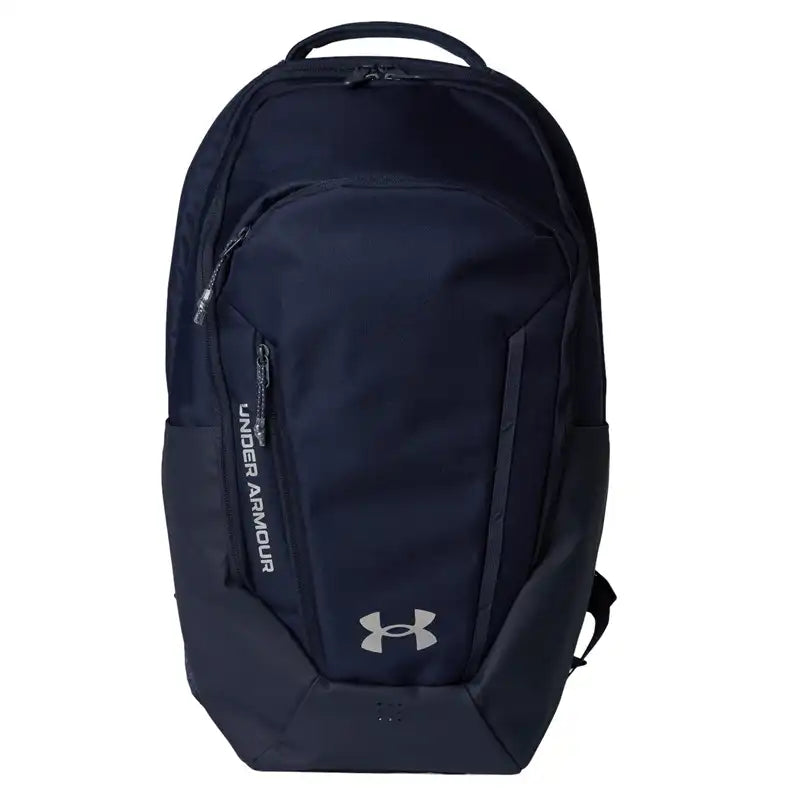 A dark navy blue Under Armour backpack with a silver logo 